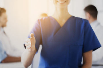 Image showing close up of doctor reaching out hand at hospital