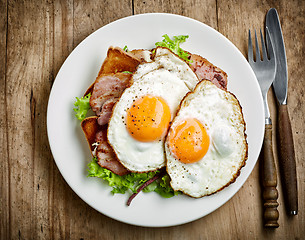 Image showing fried eggs on white plate