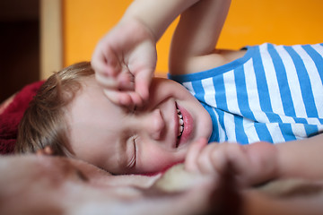 Image showing Little sleepy boy on the bed