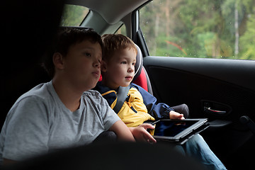 Image showing Two boys in the car with tablet PC