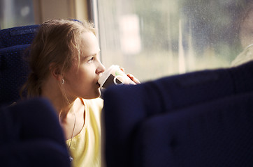 Image showing Pensive woman traveling by train