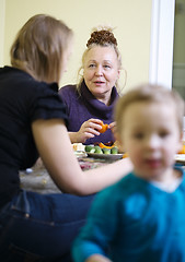 Image showing Elderly mother and daughter enjoying a meal