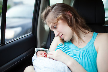 Image showing Mother with newborn in the car