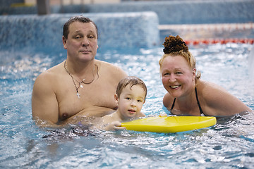 Image showing Grandparents and a grandson in the swimming pool