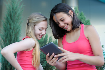 Image showing Two teen girls with tablet PC