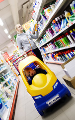 Image showing Mother and son shopping in a supermarket