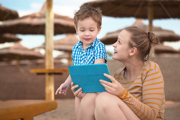 Image showing Little boy with is mother at a beach resort