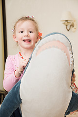 Image showing Girl Playing with Plush Toy