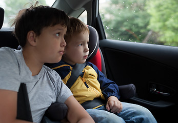 Image showing Boys looking out the car window