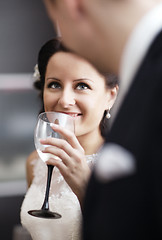 Image showing Elegant woman drinking wine at a function