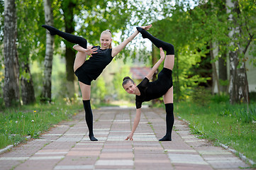 Image showing Young gymnast girls posing outdoor