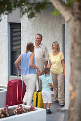 Image showing Mother and son arriving at parents house