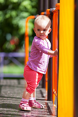 Image showing Small infant standing in playground