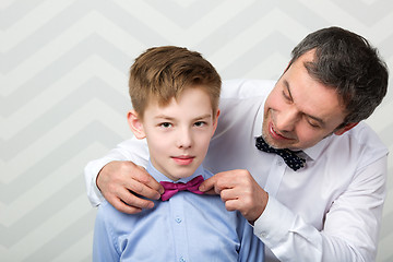 Image showing Father adjusting sons bowtie