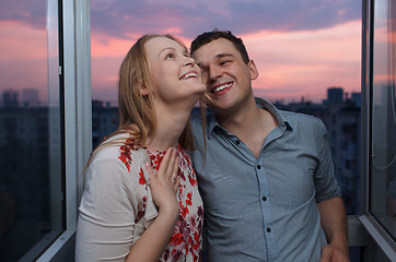Image showing Young happy couple on the balcony