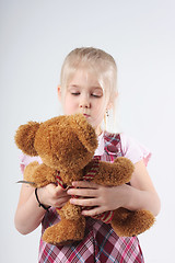 Image showing Small girl and teddy