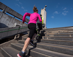 Image showing woman jogging on  steps