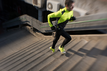 Image showing man jogging on steps