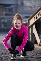 Image showing woman  stretching before morning jogging