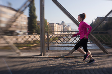 Image showing sporty woman jogging on morning