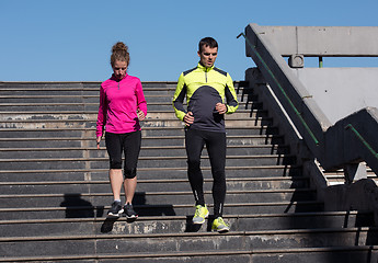 Image showing young  couple jogging on steps