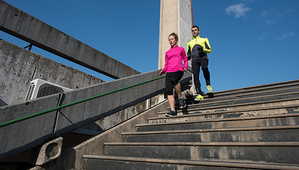 Image showing young  couple jogging on steps