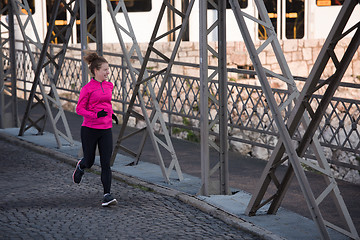 Image showing sporty woman jogging on morning