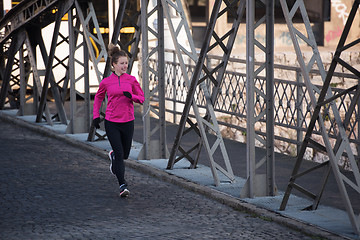 Image showing sporty woman jogging on morning