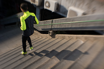 Image showing man jogging on steps