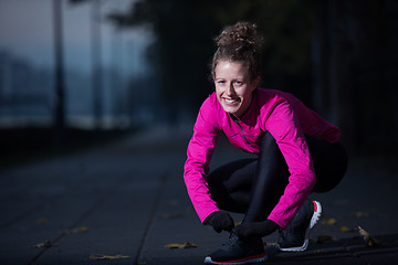 Image showing woman  stretching before morning jogging