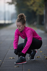 Image showing woman  stretching before morning jogging