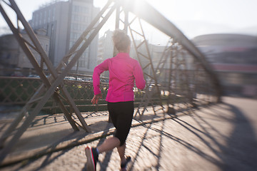 Image showing sporty woman jogging on morning