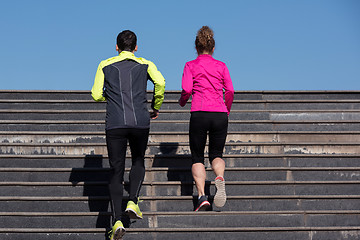 Image showing young  couple jogging on steps