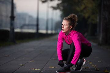 Image showing woman  stretching before morning jogging