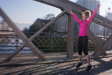 Image showing woman  stretching before morning jogging