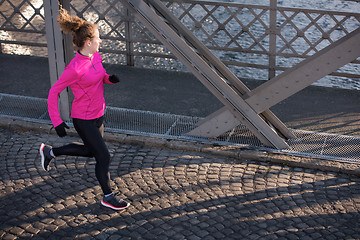 Image showing sporty woman jogging on morning