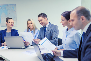 Image showing business team with laptop having discussion