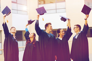 Image showing group of smiling students in mortarboards