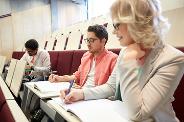 Image showing group of students with notebooks at lecture hall