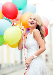 Image showing woman with colorful balloons