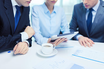 Image showing business team with graph, tablet pc and coffee