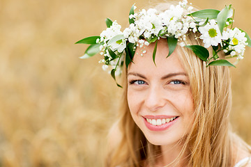 Image showing happy woman in wreath of flowers