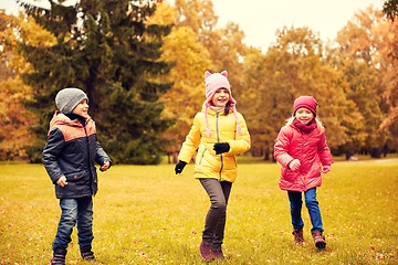 Image showing group of happy little kids running outdoors