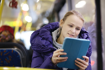 Image showing Woman with touchpad in the bus
