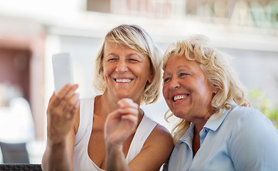 Image showing Modern mature women making happy mobile selfie 