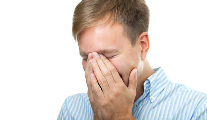 Image showing Laughing man hiding the face isolated on white