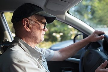 Image showing Senior man at the wheel