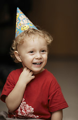 Image showing Cute happy young boy in a party hat