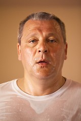 Image showing Tired looking middle-aged man after a workout