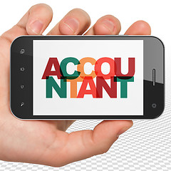 Image showing Banking concept: Hand Holding Smartphone with Accountant on  display